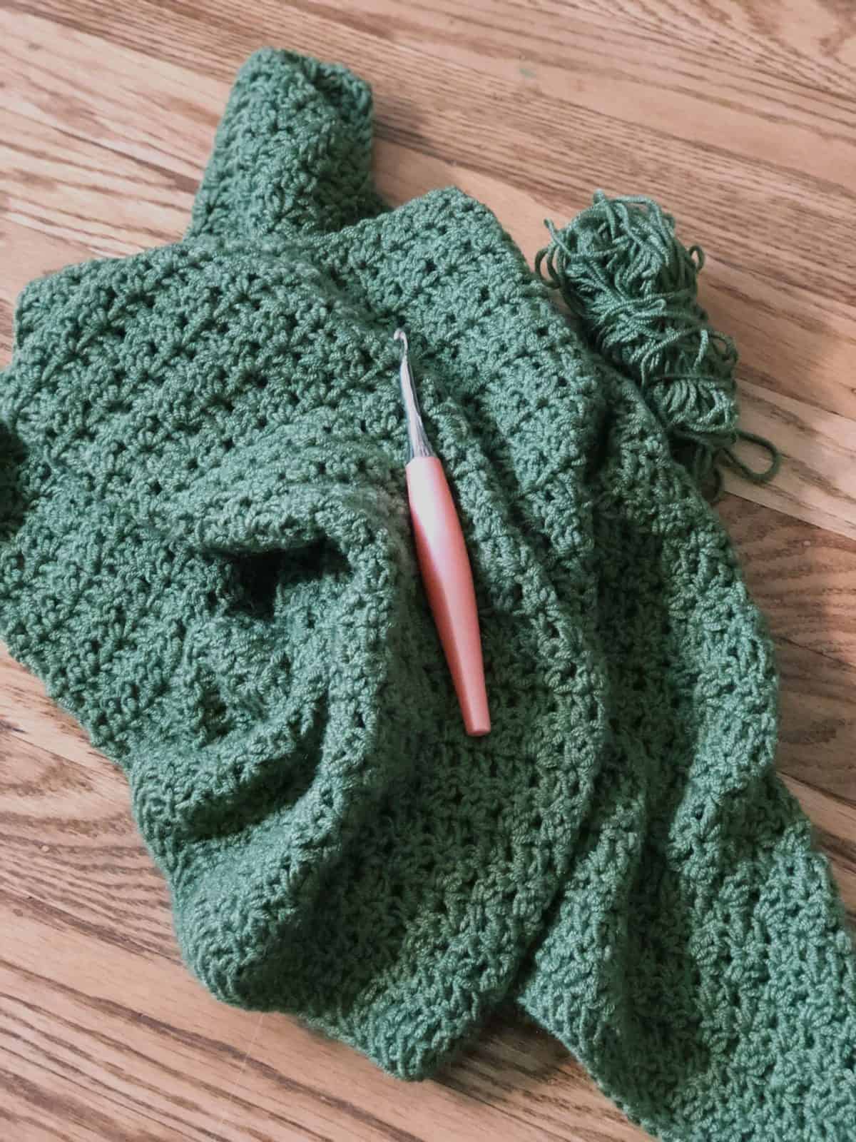 Picture of crochet cardigan wip and hook