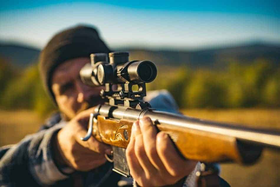 What magnification is needed to shoot for distance