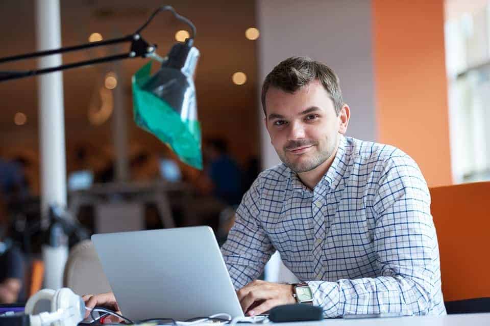 cleaning-business-owner-writing-his-employee-handbook
