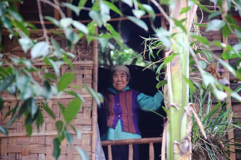 mai chau lady old vietnamese standing in the window