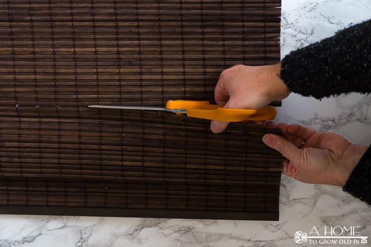 This is a great tutorial on where to buy inexpensive bamboo shades for any size window and how to easily shorten them to get a custom made look. Pin it so you don't forget it!
