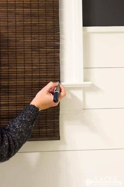 This is a great tutorial on where to buy inexpensive bamboo shades for any size window and how to easily shorten them to get a custom made look. Pin it so you don't forget it!