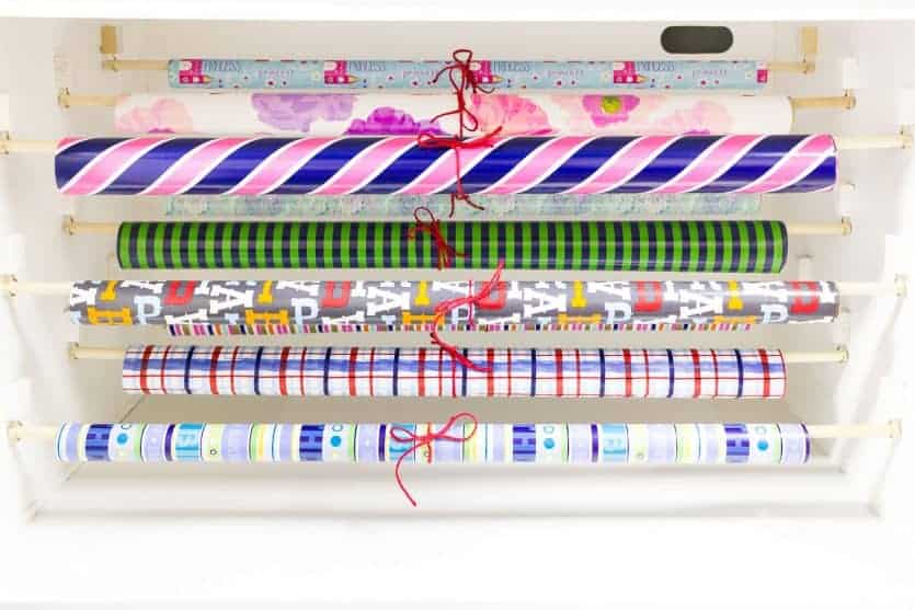 It's easy to repurpose an old armoire into a beautiful and organized gift wrapping station for your craft room! Lots of ideas on how to DIY this yourself!