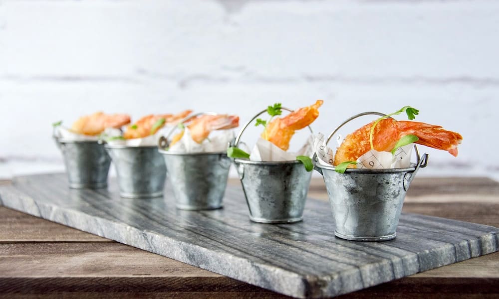 A bowl of food on a table Description automatically generated
