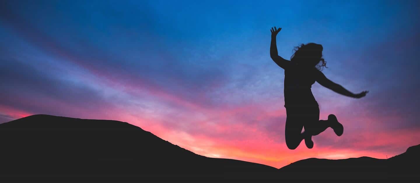 safely sleep through your withdrawals while under sedation in the hospital - girl jumping in the air with excitment