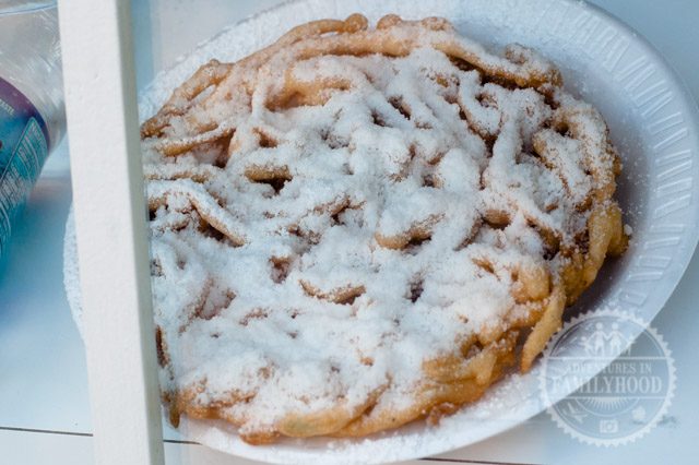 funnel cake on display at the stand in the American Adventure pavilion at Epcot
