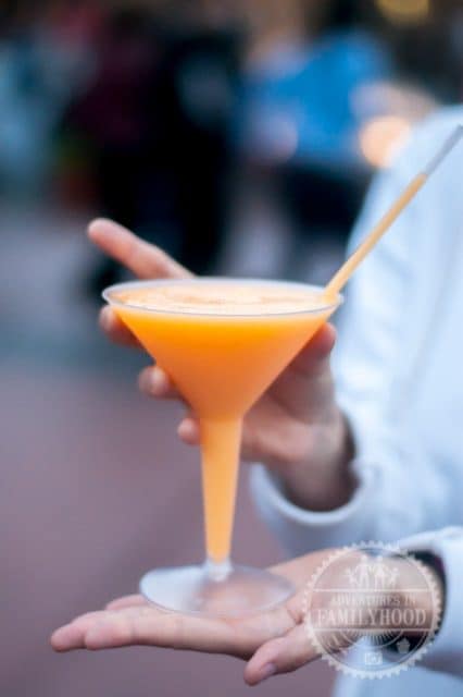 lisa holds the grand marnier slush in France pavilion at Epcot