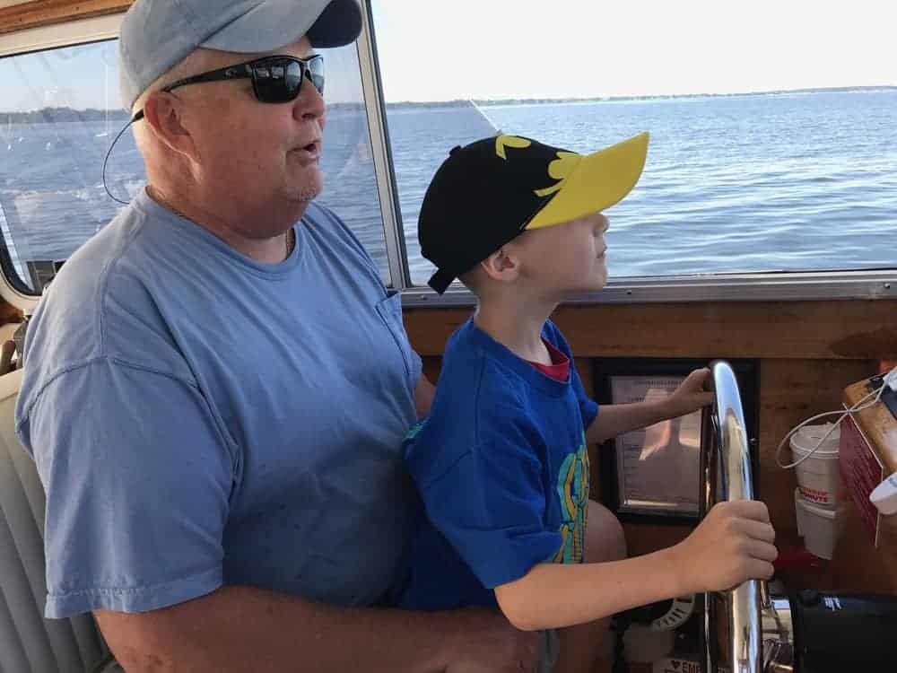 Captain Eichler and Houston at the helm.