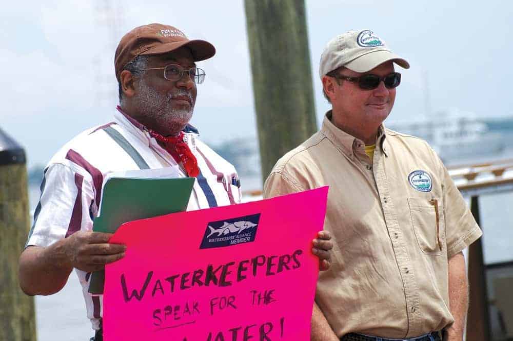 Tutman, protest sign in hand, stands with fellow riverkeepers protesting the lack of progress in at the Annapolis City Dock event is Tim Junkin, of the Midshore Riverkeeper Conservancy. Courtesy of Fred Tutman.