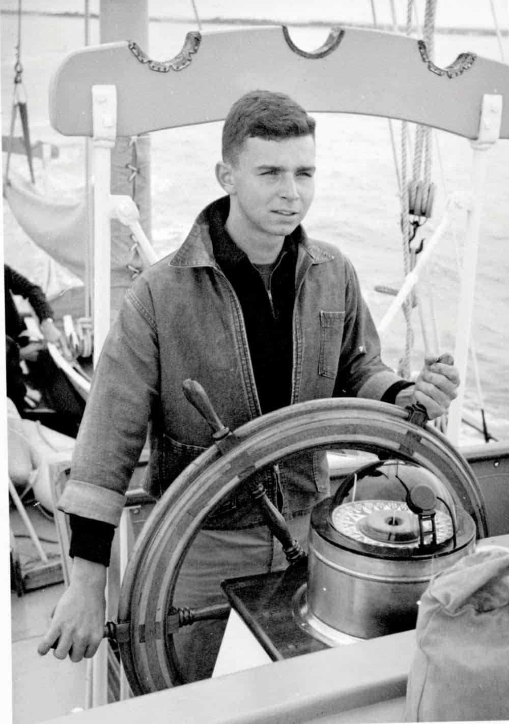 Hecklinger, age 18, at the helm of a 59-foot motorsailor. Photo by Joe Evans.