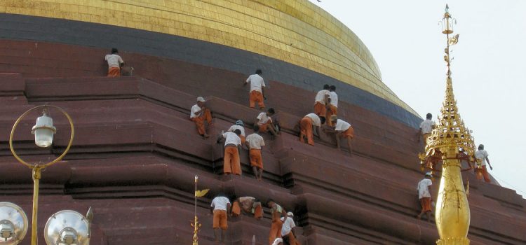 workers restoring stupa at Shwedagon temple Buddhist Initiation at Shwedagon