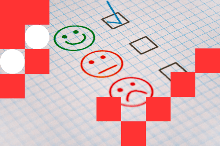 Three smiley faces (happy, indifferent, and sad) drawn on a piece of paper with checkboxes next to them. A tick is put in the happy face box as the approval of the 5-star rating of the app.