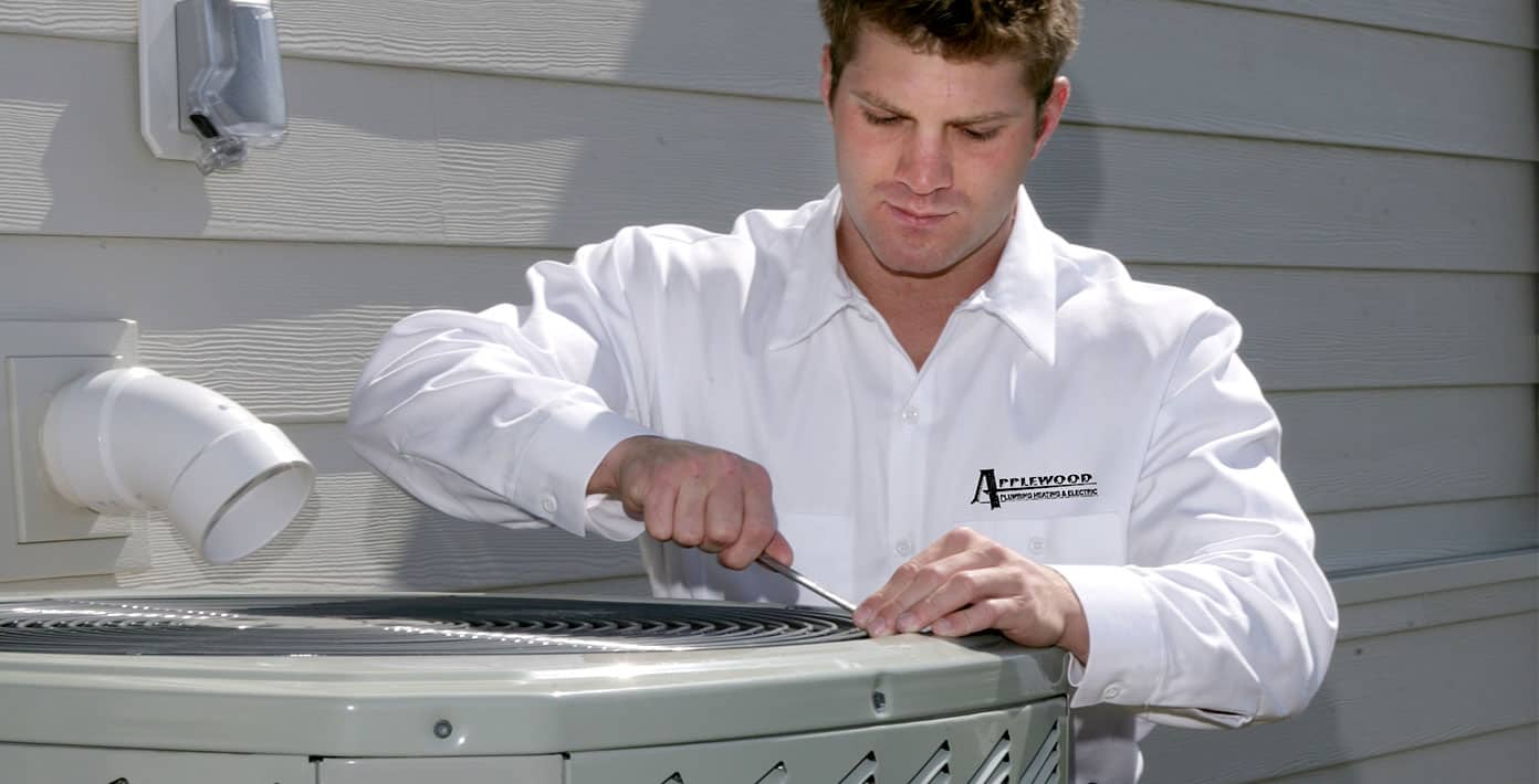 applewood employee fixing air conditioner