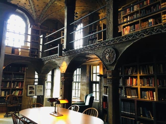 The ornate library room with art depicting local history at the Mercer Museum near New Hope, PA
