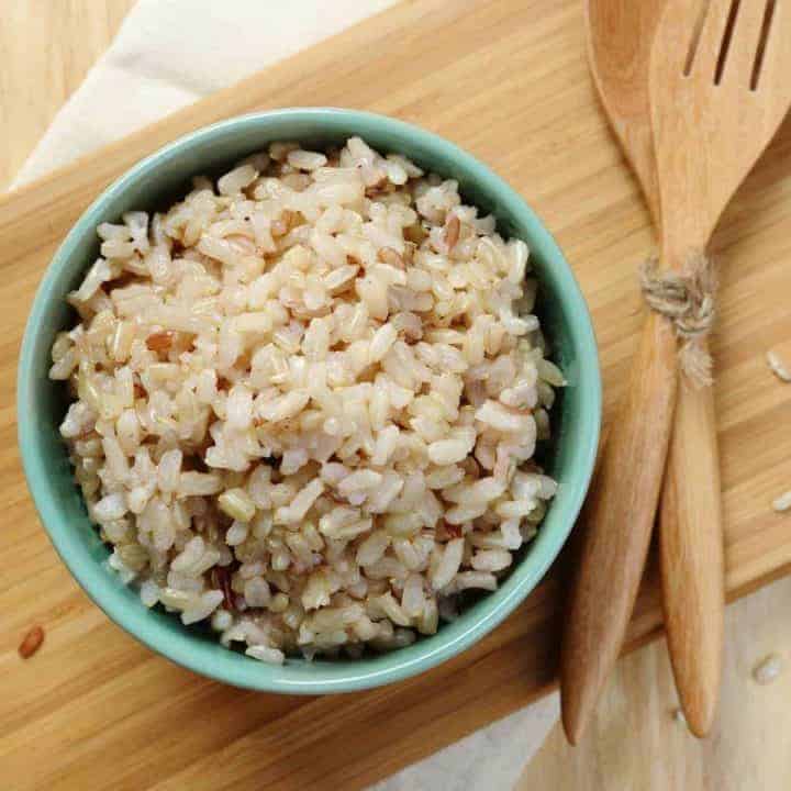 bowl of brown rice with utensils