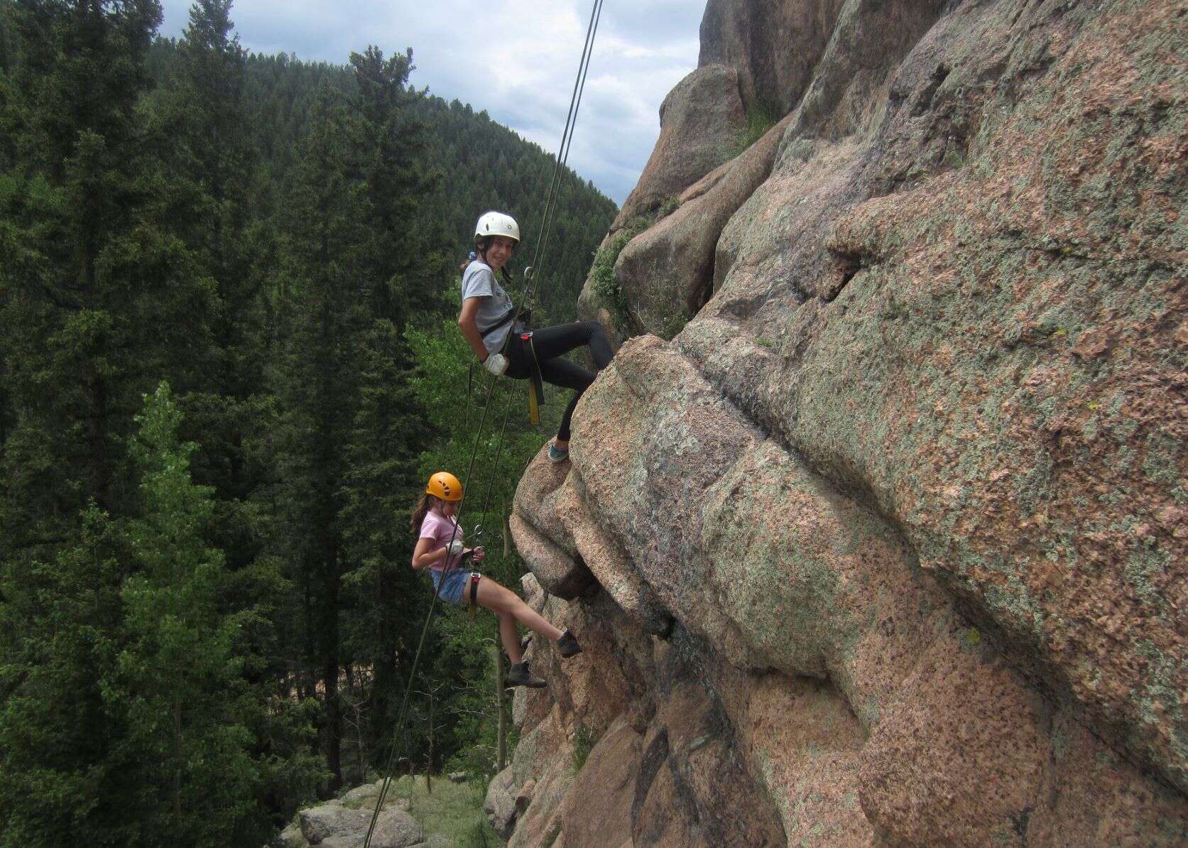 89 Wild II (5) Wilderness campers repelling down a cliff face.