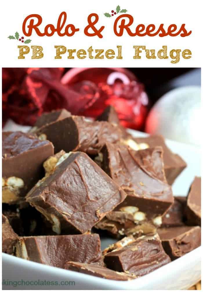 Rolo Reeses PB Pretzel Fudge - An outrageous outburst of Reeses\' peanut butter cups, crunchy salted pretzels and caramel Rolos\' surrounded in a smooth chocolate fudge on top. #chocolate #fudge #peanut butter #pretzel #reeses #rolo #holiday #sweet and salty