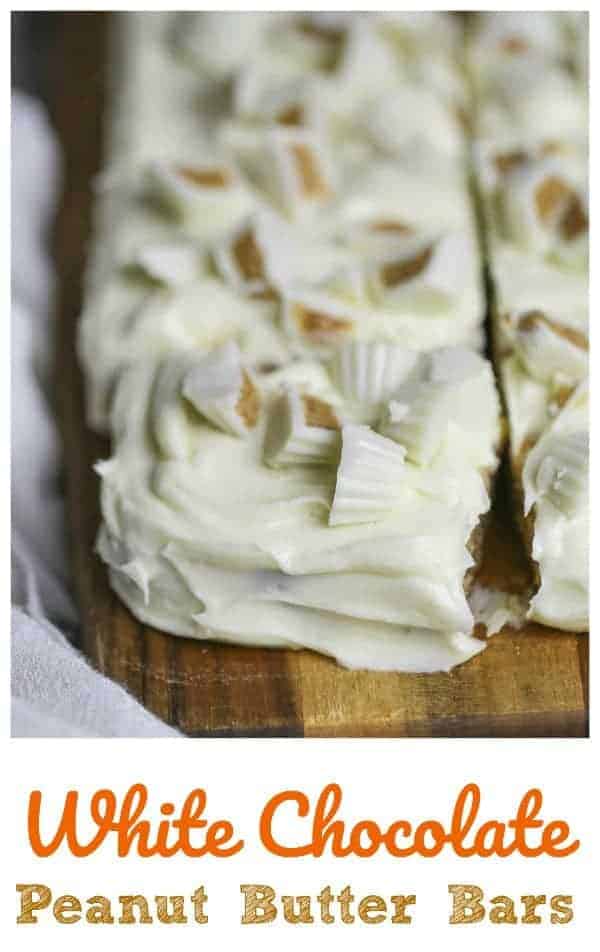 White Chocolate Peanut Butter Bars - Deliciously peanut butter cake bars topped with a dreamy white chocolate buttercream and Reese's mini white chocolate peanut butter cups. PB lover inspired!