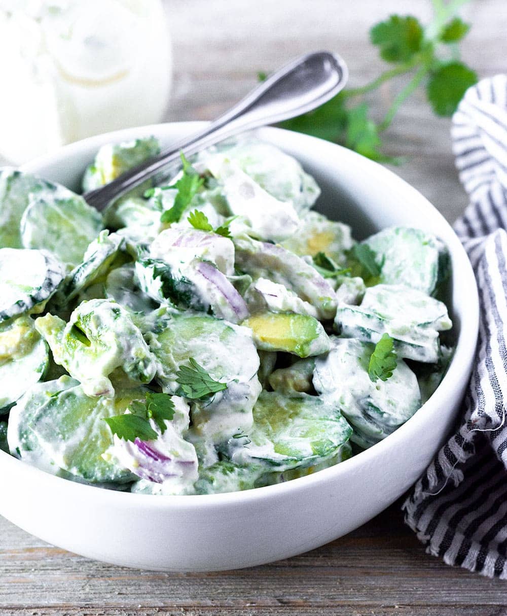 Cucumber avocado salad in a bowl,