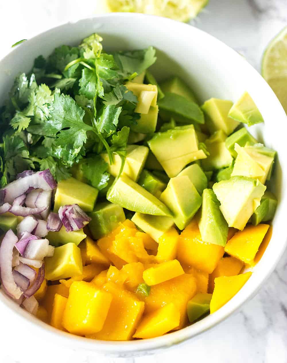 Mango Avocado Salsa Ingredients in a white bowl