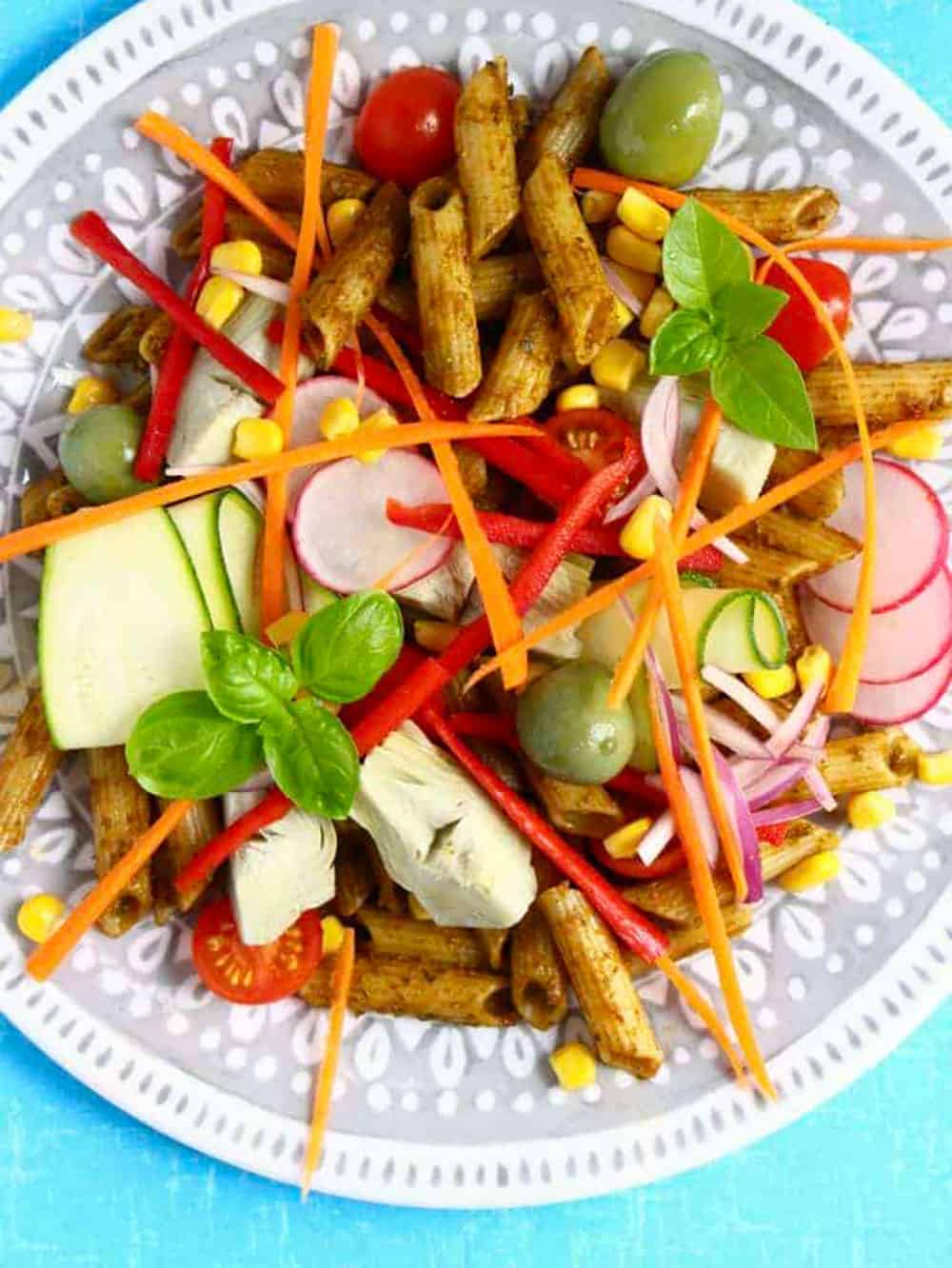 Sun dried tomato pesto pasta with glutn-free pasta, olives, artichoke hearts, radish, carrot