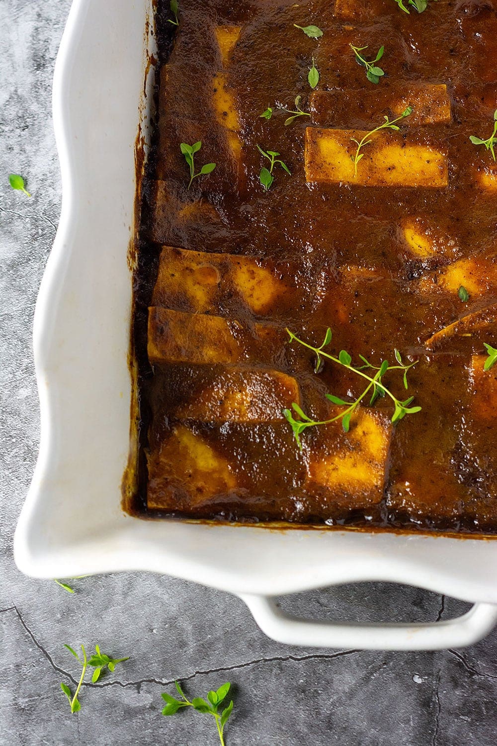Jerk Tofu overlay showing one section of white bowl with jerk tofu