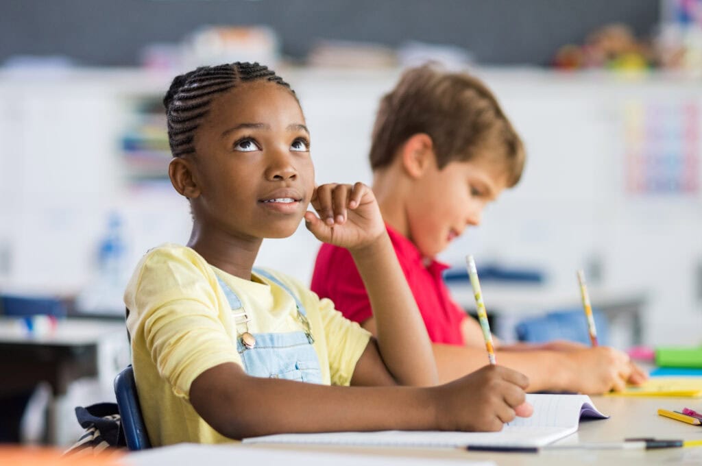 elementary aged girl taking reading assessment