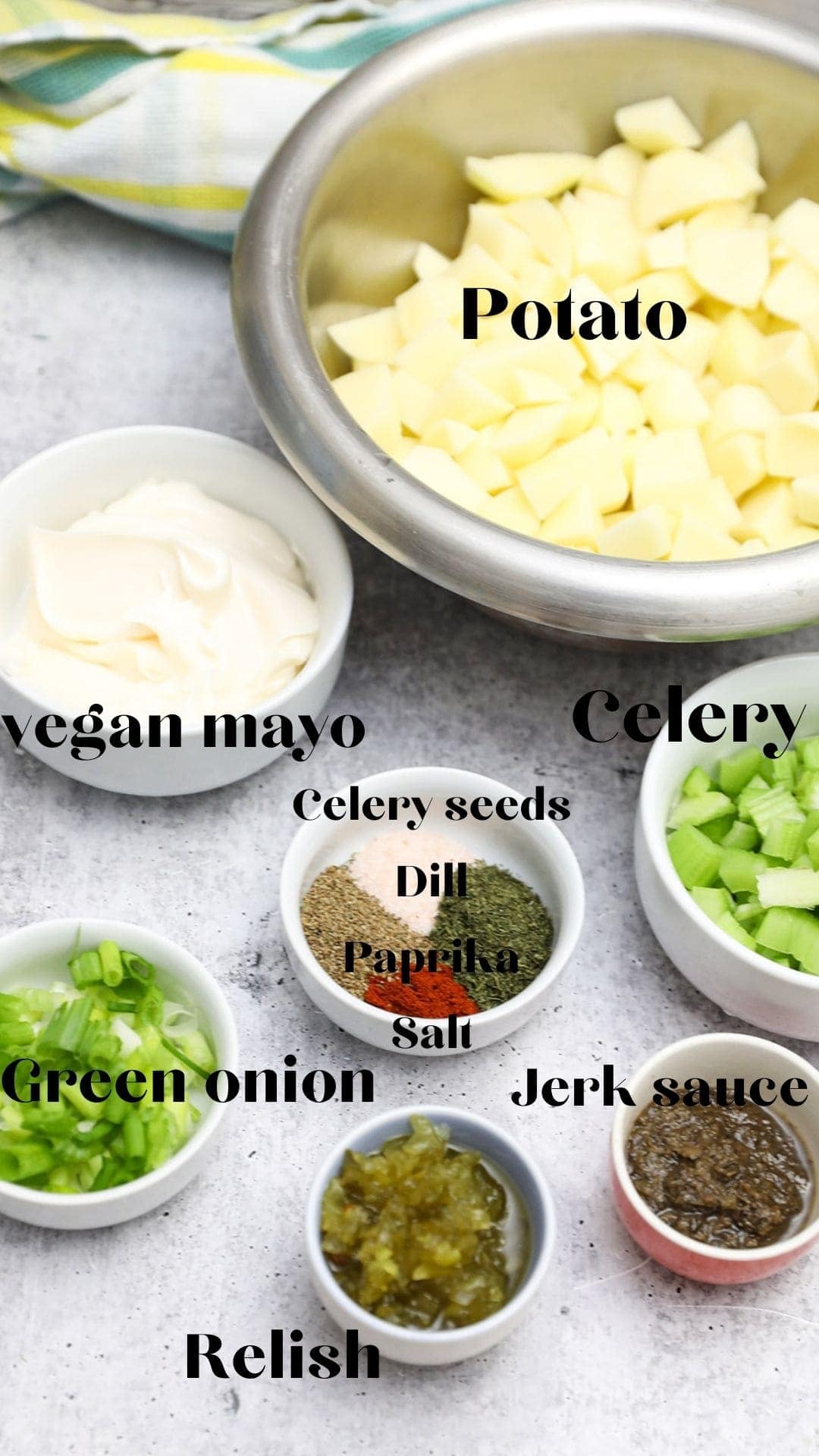 Jerk potato salad ingredients in bowls