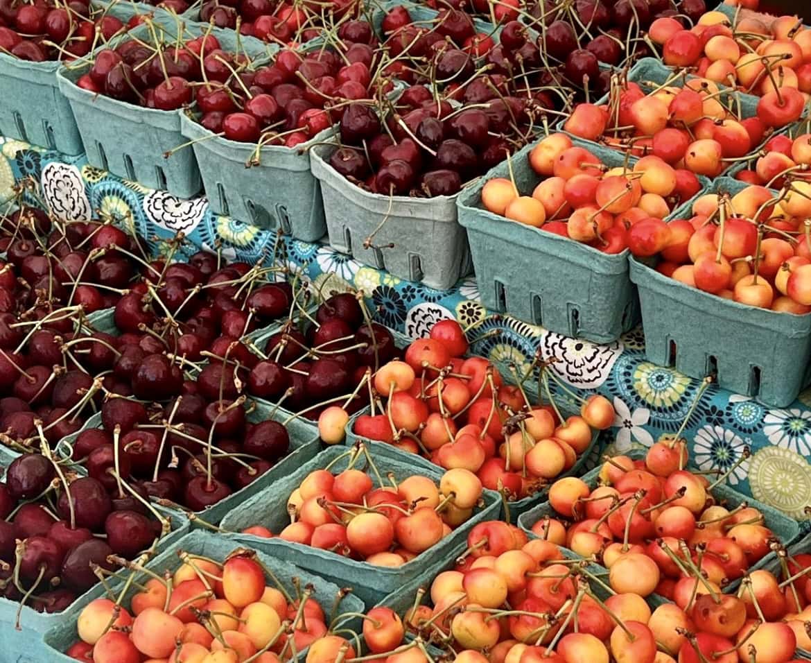 An assortment of fresh cherries available at Kingston's Farmers Market, within walking distance of Hotel Kinsley.