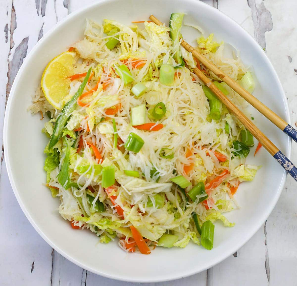 close up napa cabbage salad in a white background in a white bowl
