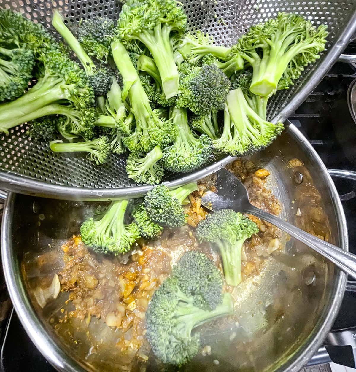 broccoli curry cooking in spices