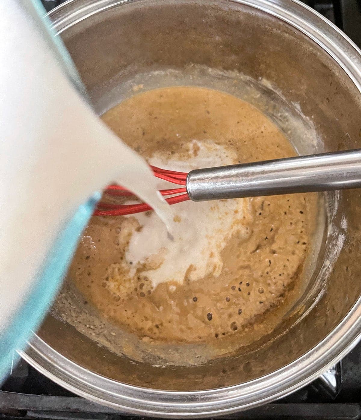 adding cashew milk to roux