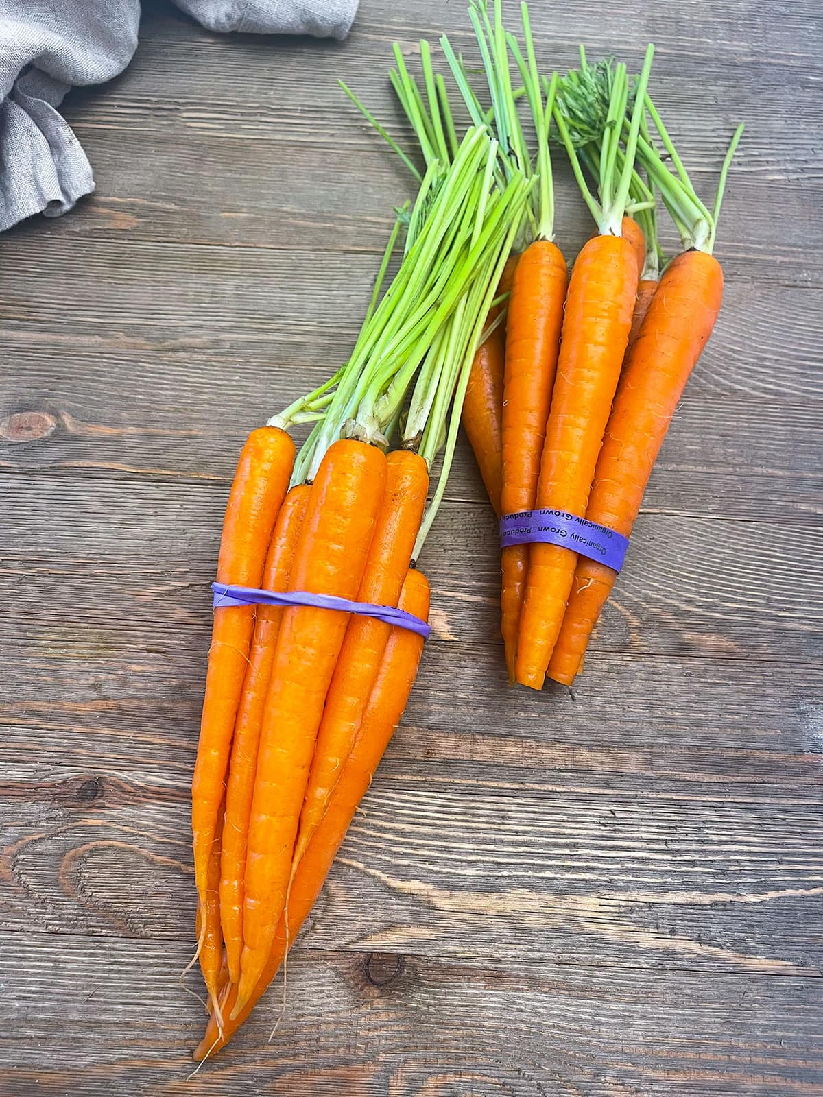 carrot bunches on a wooden board