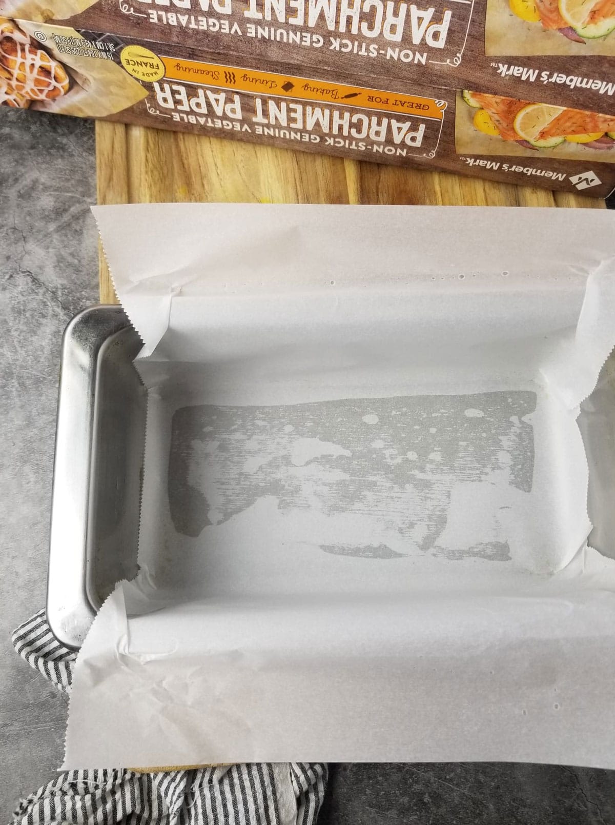 baking pan lined with parchment paper for making vegan pound cake