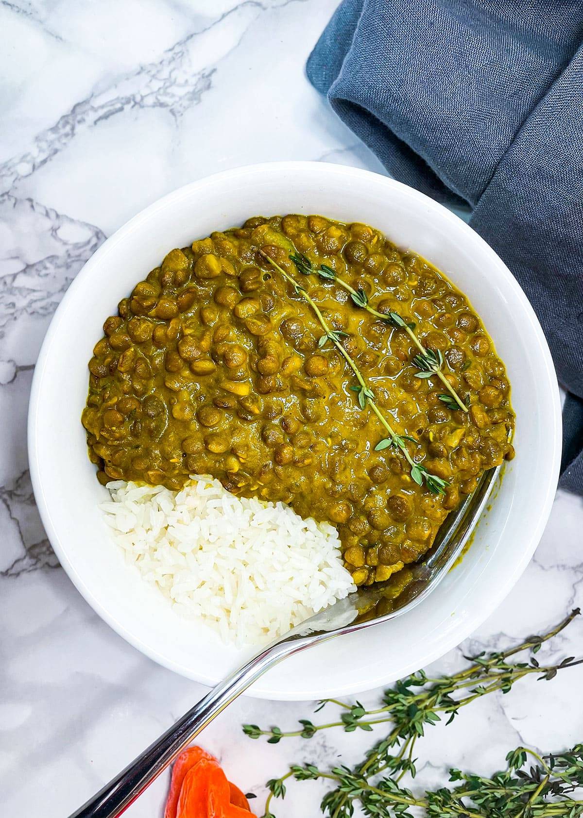 vegan curry lentil in a white plate on a white background