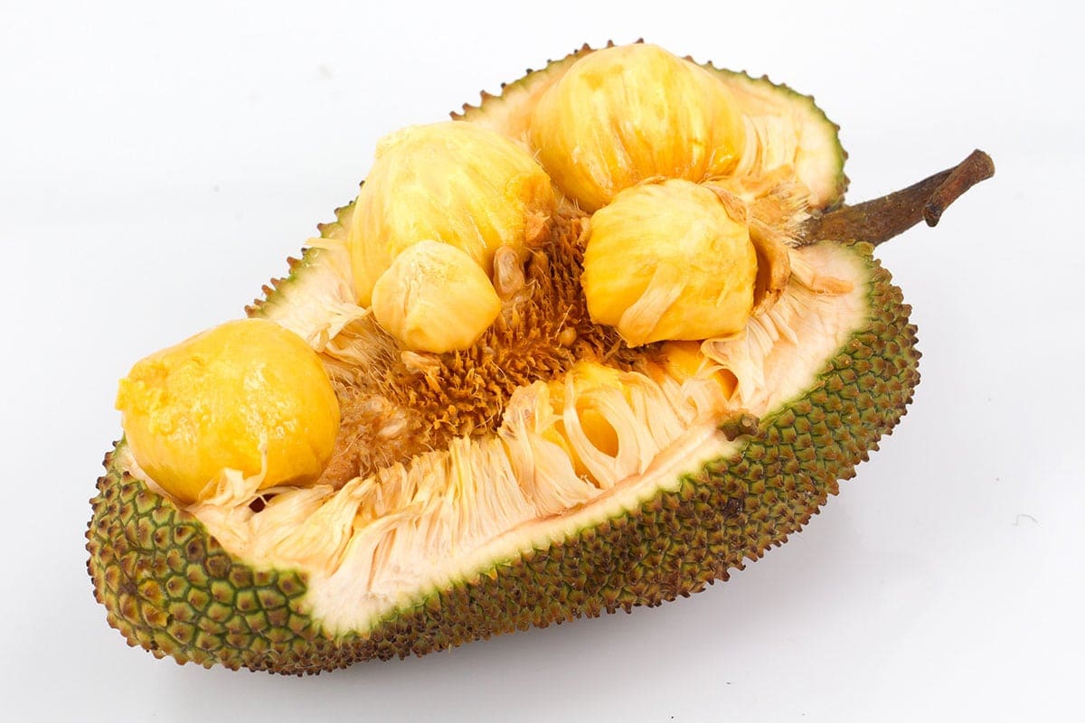 CEMPEDAK cut in half on a white background