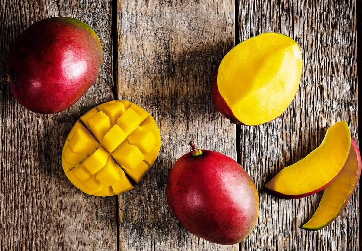 mango slices on wooden board