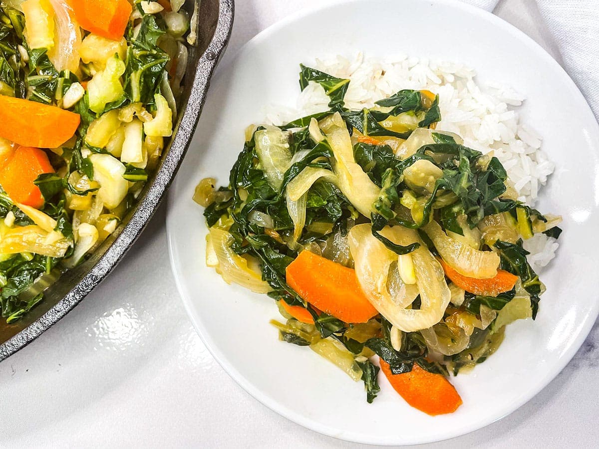 Jamaican chop suey on a white plate served with rice