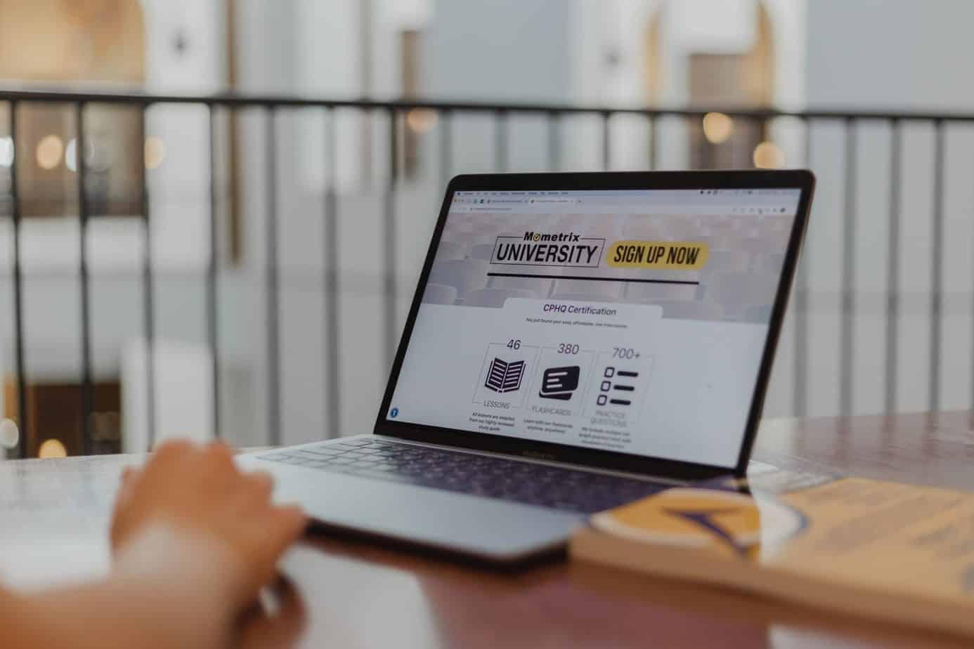 Person getting educated online on a laptop.