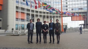 SSDP Ireland and UK standing under the UN Member State flags. From left to right: Connor Kilgallen, Graham de Barra, Cliodhna Bairead, Ciaran Maher, Ayesha Mian