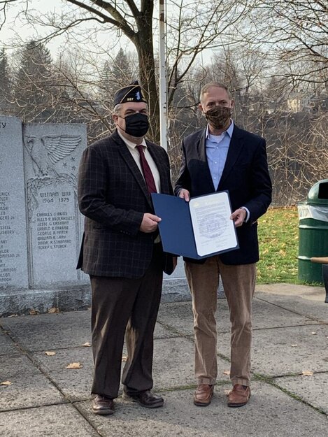New York state assemblyman Will Barclay presenting Peter Allen with a citation