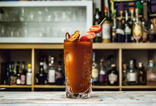 Virgin Bloody Mary Mix Recipe From Scratch - glass of bloody mary on a white marble bar top
