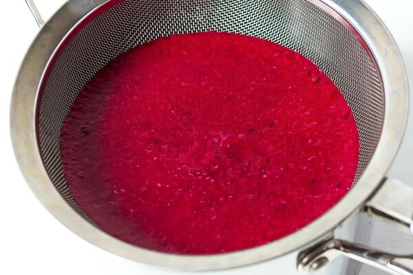 Prickly pear juice in strainer