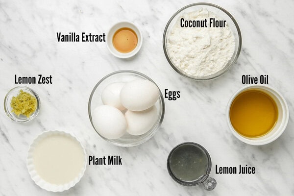 All ingredients for gluten free lemon cake in small individual bowls