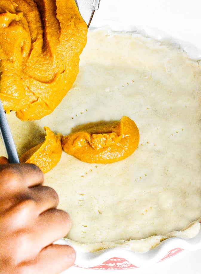 Sweet Potato Pie Filling Being Poured over crust