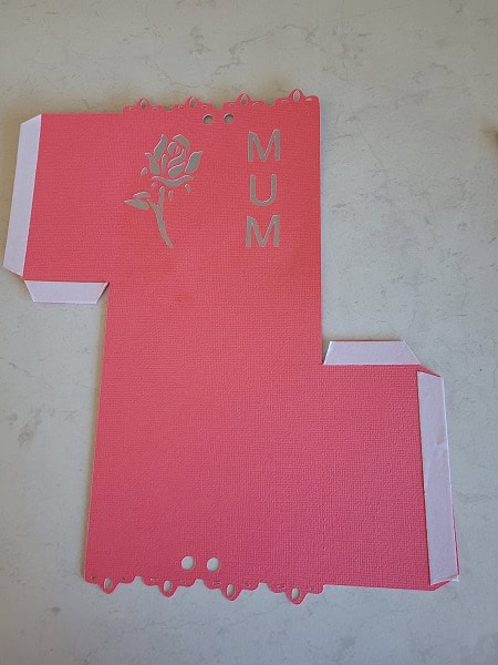 Gift box file cut out with double sided tape ready to stick the sides together and make the box.