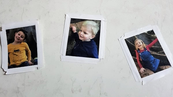 Small photos of kids for the Father's Day card with double-sided tape on them.