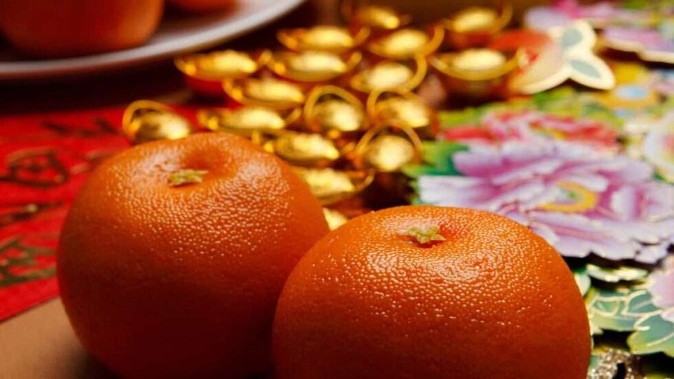 Oranges sit amid festive decorations for the Chinese New Year.