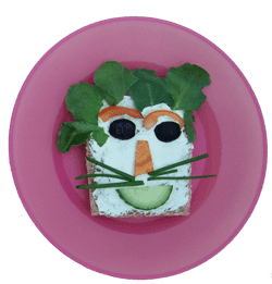 Kids can cook their own healthy an fun food, like this veggie face sandwich at a local amsterdam cafe