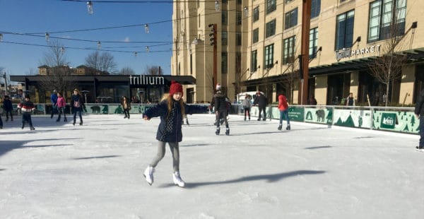 A seasonal ice rink in landrmark park near fenway park.